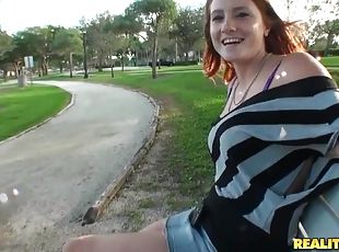 Redhead Lindsey fondles her tits and rides big dick