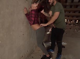 Nasty redhead chick gets stuffed by two guys at the abandoned house