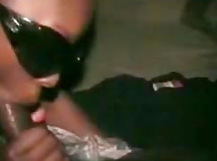 Ebony in sunglasses is sucking a dick