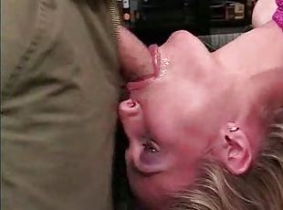 Her throat is abused by a big cock