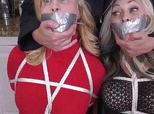 Two milfs in bondage and gagged with duct tape in their boots