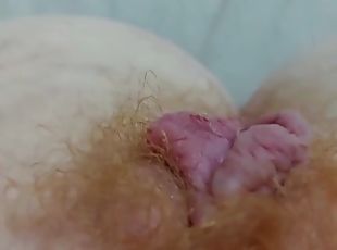 Close up video of a horny redhead fingering her hairy pussy