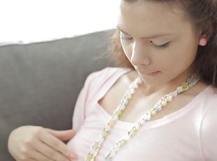 Girl with a pear necklace fingers herself on the floor