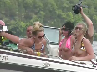 Nasty amateur girls sitting in a boat flash their boobs