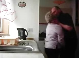 Chubby granny gets fondled in the kitchen by her hubby