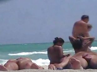 Voyeur's cam catches an Asian pussy on a nude beach