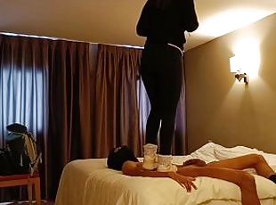 Sneakers trampling on bed