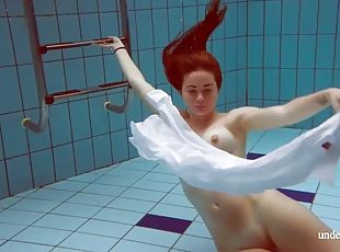 Redhead with big tits Lola underwater naked