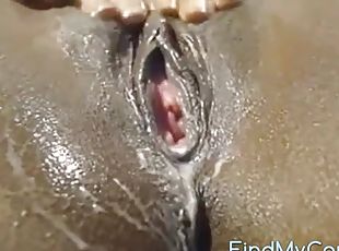 Ebony slut finger fucks her hairless snatch